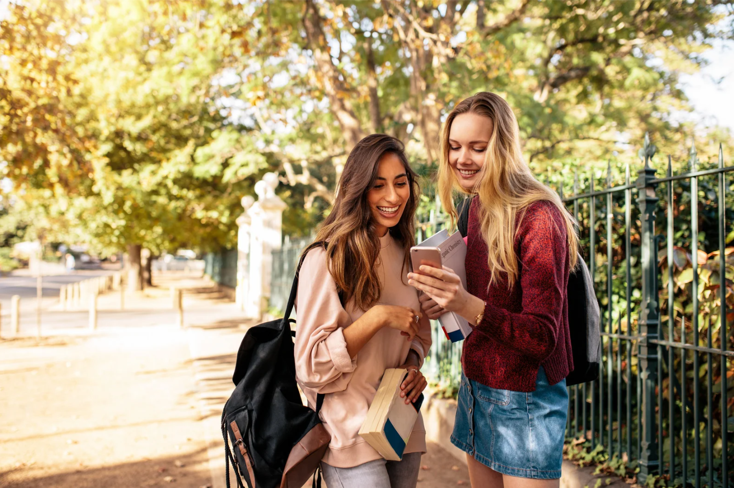 girls looking at phone